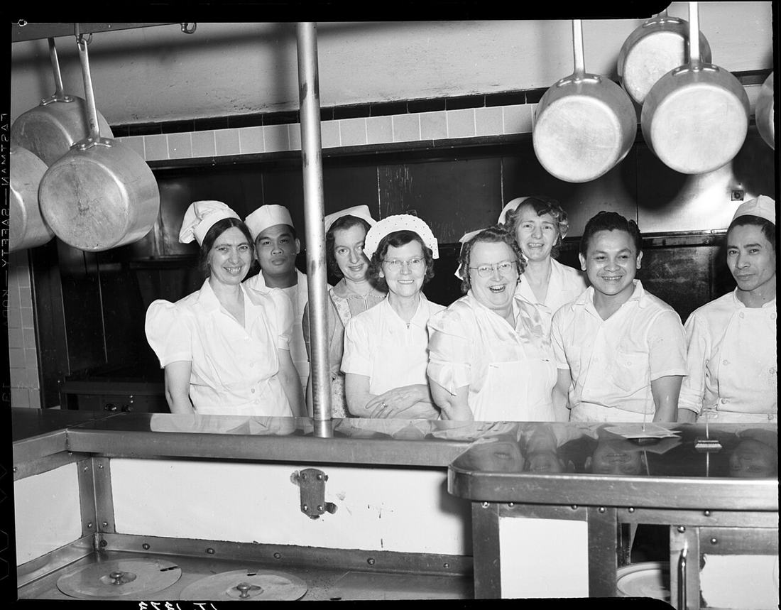 Workers in a historic Seattle hotel kitchen